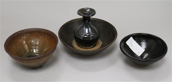 Three Chinese Jian or Henan type bowls and a vase, diameter 15.5cm, vase 10cm